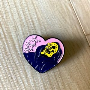 Love laugh love skeletor pin